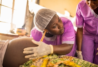 Student midwife checking fetus ©UNFPA Sierra Leone