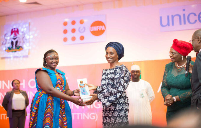 Wife of the Vice President, H.E Mrs. Dolapo Osinbajo presenting the Efua award to the Winner Diana Kendi Makala