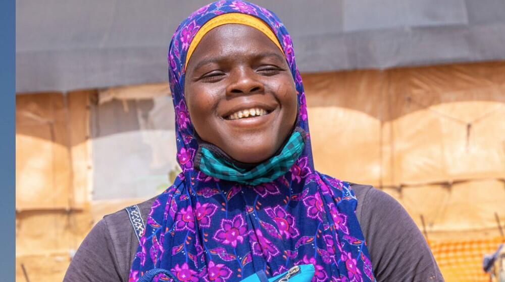 Young woman receiving a dignity kit in the northcentral region in Burkina Faso where conflict has led to displacement. ©UNFPA/Bu