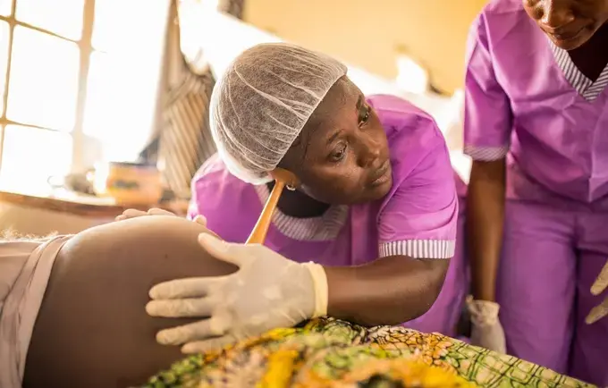 Student midwife checking fetus ©UNFPA Sierra Leone